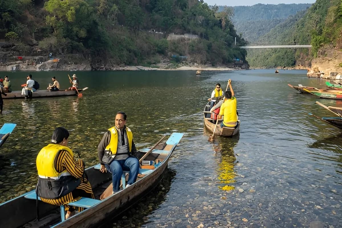People boating in the crystal clear Dawki River